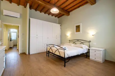 Letto o letti in una camera di Santo Spirito Bright Flat by Mmega