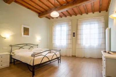 Letto o letti in una camera di Santo Spirito Bright Flat by Mmega