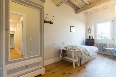 Letto o letti in una camera di Oltrarno Real Mood Florentine Apartment