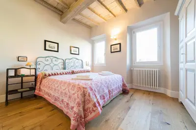 Letto o letti in una camera di Oltrarno Real Mood Florentine Apartment