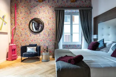Letto o letti in una camera di Kairos by Florence Art Apartments