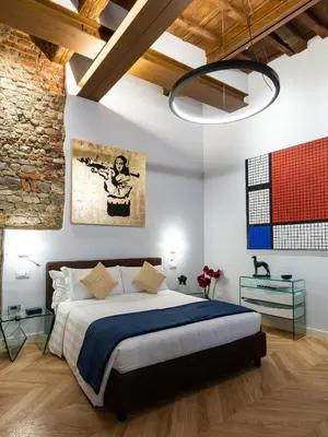 Letto o letti in una camera di Kairos by Florence Art Apartments
