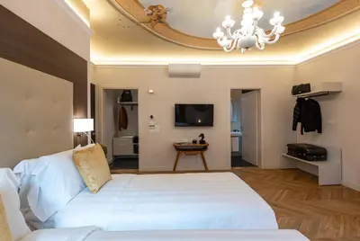 Letto o letti in una camera di Kairos by Florence Art Apartments