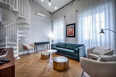 Area soggiorno di Hs4U Ricasoli Luxury apartment near Duomo N. 3