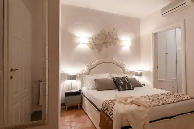 Letto o letti in una camera di Toscanella - Flo Apartments