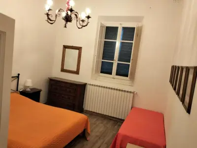 Letto o letti in una camera di Appartamento Cosimo