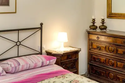 Letto o letti in una camera di Appartamento Cosimo