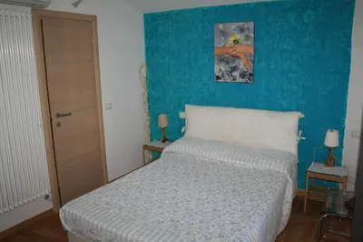Letto o letti in una camera di TataBlu residenza con parcheggio