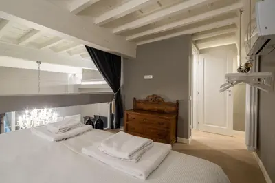 Letto o letti in una camera di Casa Velluti Deluxe by Mmega