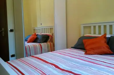Letto o letti in una camera di Charming Family Lodge With Private Garage