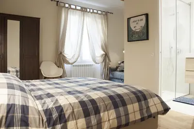 Letto o letti in una camera di Gilbe One Apartment by Mamo Florence