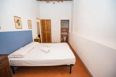 Letto o letti in una camera di Roomy and elegant apartment by Piazza Pitti