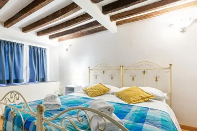 Letto o letti in una camera di GuestHost - Giardino Bardini Cozy Apartment