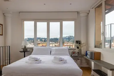 Letto o letti in una camera di LoveTheView 360° - LoveTheApartments