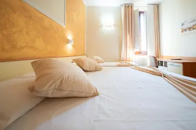 Letto o letti in una camera di Hotel Angelica Firenze