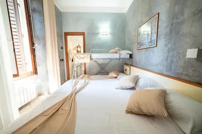Letto o letti in una camera di Hotel Angelica Firenze