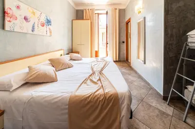 Letto o letti in una camera di Hotel Angelica Firenze