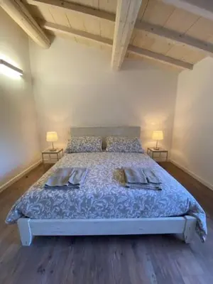 Letto o letti in una camera di La Magnolia