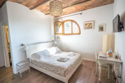 Letto o letti in una camera di La Magnolia