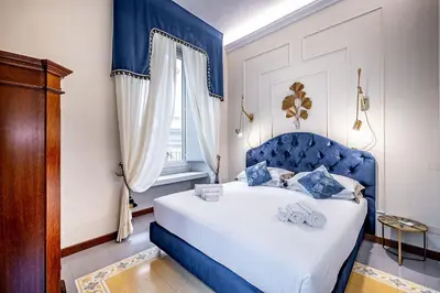 Letto o letti in una camera di THREE APARTMENTS Via Roma