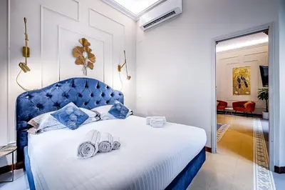 Letto o letti in una camera di THREE APARTMENTS Via Roma