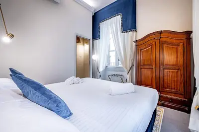 Letto o letti in una camera di THREE APARTMENTS Via Roma