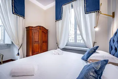 Letto o letti in una camera di THREE APARTMENTS Via Roma