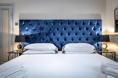 Letto o letti in una camera di THREE APARTMENTS Via Roma