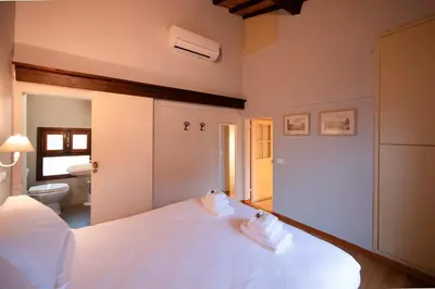 Letto o letti in una camera di Duomo Suite con balcone