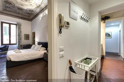 Letto o letti in una camera di Tegolaio Apartments by Mamo Florence