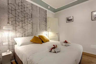 Letto o letti in una camera di Ricasoli Apartment by Mamo Florence
