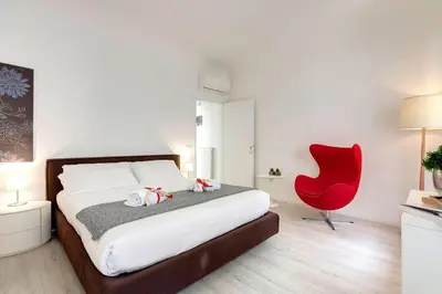 Letto o letti in una camera di Velluti Apartment by Mamo Florence