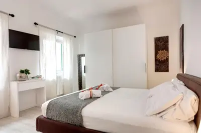 Letto o letti in una camera di Velluti Apartment by Mamo Florence