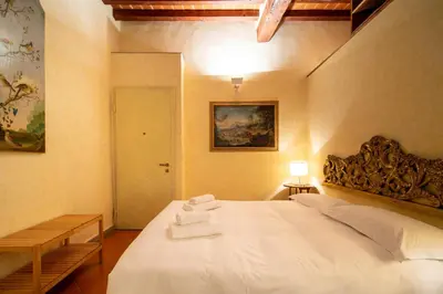 Letto o letti in una camera di Oltrarno Apartment