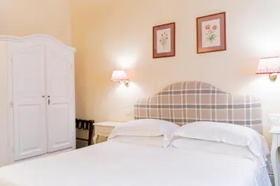 Letto o letti in una camera di Casa Uffizi XIII Century Tower House Boutique Hotel