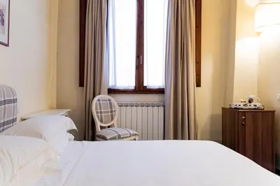 Letto o letti in una camera di Casa Uffizi XIII Century Tower House Boutique Hotel