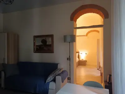 Letto o letti in una camera di Palazzo Guasti Appartamento Il balcone