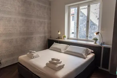Letto o letti in una camera di PONTE VECCHIO LUXURY AND STYLISH APARTMENT