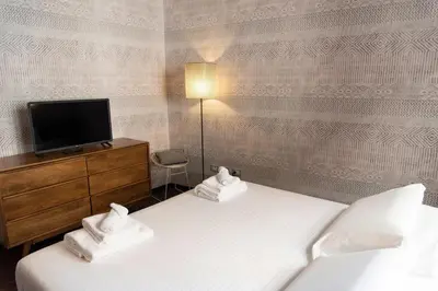 Letto o letti in una camera di PONTE VECCHIO LUXURY AND STYLISH APARTMENT