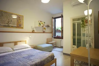 Letto o letti in una camera di B&B l'Olivo