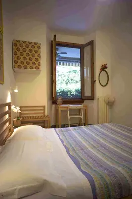 Letto o letti in una camera di B&B l'Olivo