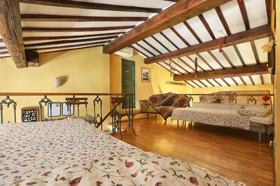 Letto o letti in una camera di A Postcard View in a Vintage Apartment
