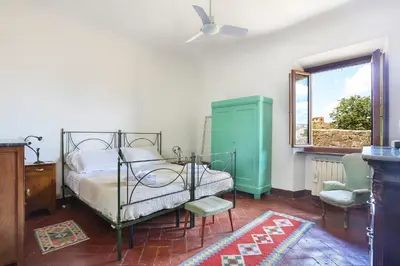 Letto o letti in una camera di A Postcard View in a Vintage Apartment