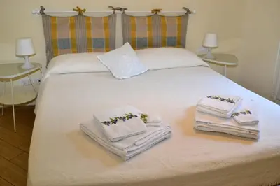 Letto o letti in una camera di Casa Olivia