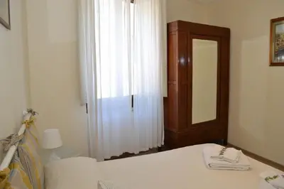 Letto o letti in una camera di Casa Olivia