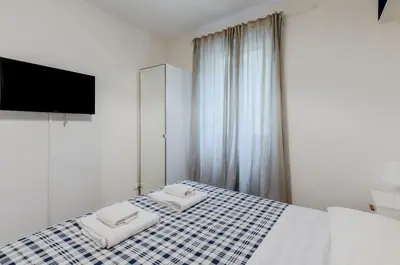 Letto o letti in una camera di GuestHost - Ponte Vecchio & Boboli Modern Apartment
