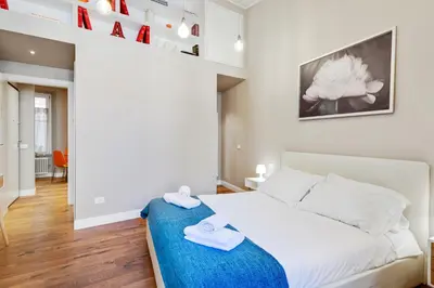 Letto o letti in una camera di GuestHost - Palazzo Pitti & Ponte Vecchio Cozy Flat