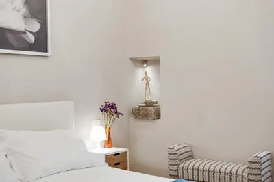 Letto o letti in una camera di GuestHost - Palazzo Pitti & Ponte Vecchio Cozy Flat