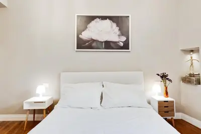 Letto o letti in una camera di GuestHost - Palazzo Pitti & Ponte Vecchio Cozy Flat