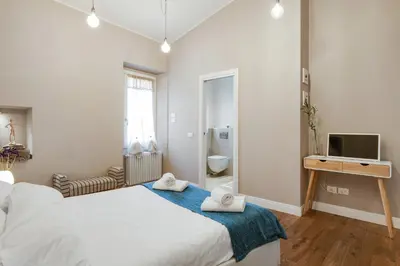 Letto o letti in una camera di GuestHost - Palazzo Pitti & Ponte Vecchio Cozy Flat